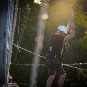 A stag adventurer navigating a challenging high ropes in Dusseldorf